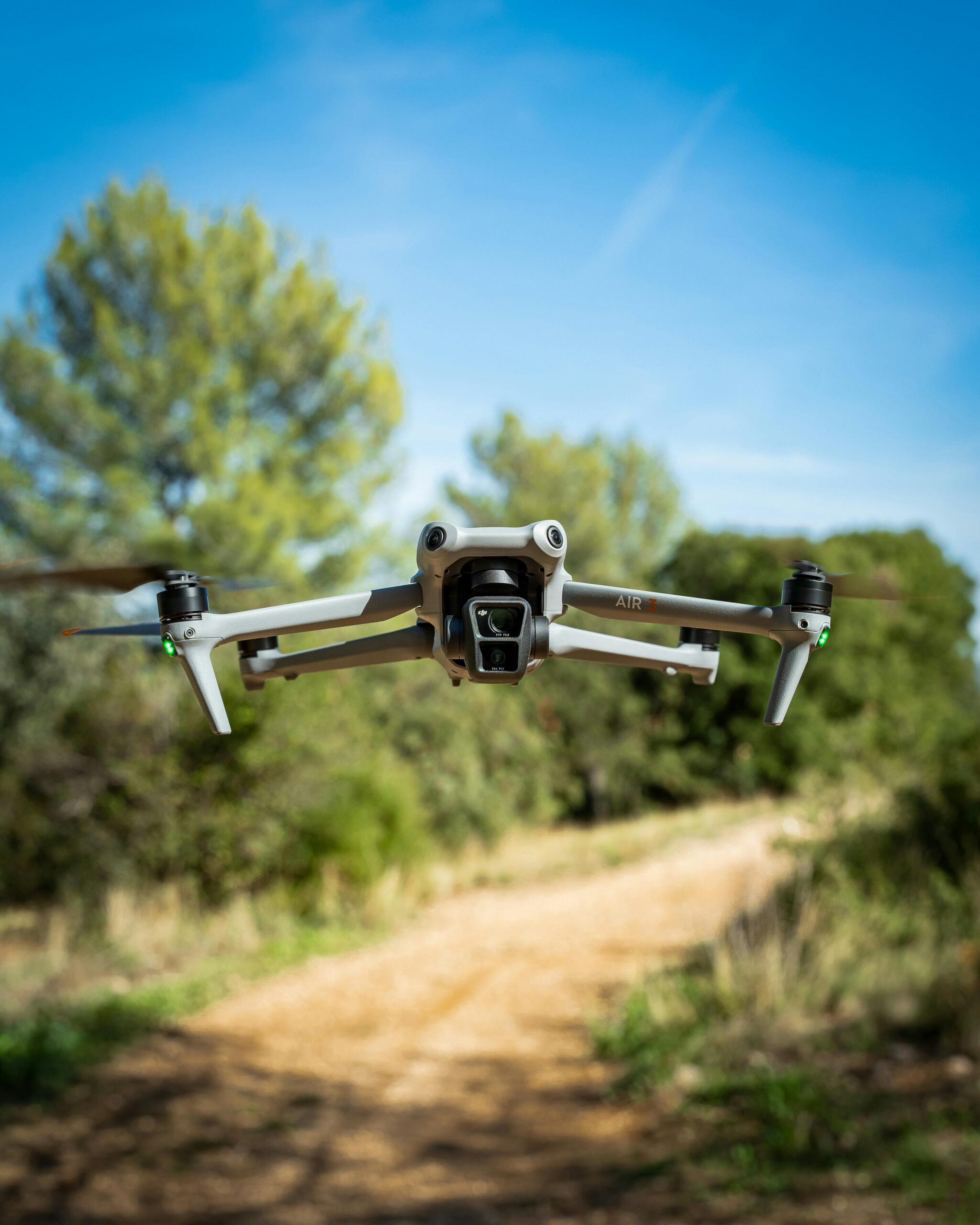 A drone in flight capturing the scenic beauty of a forest in Marseille, France.
